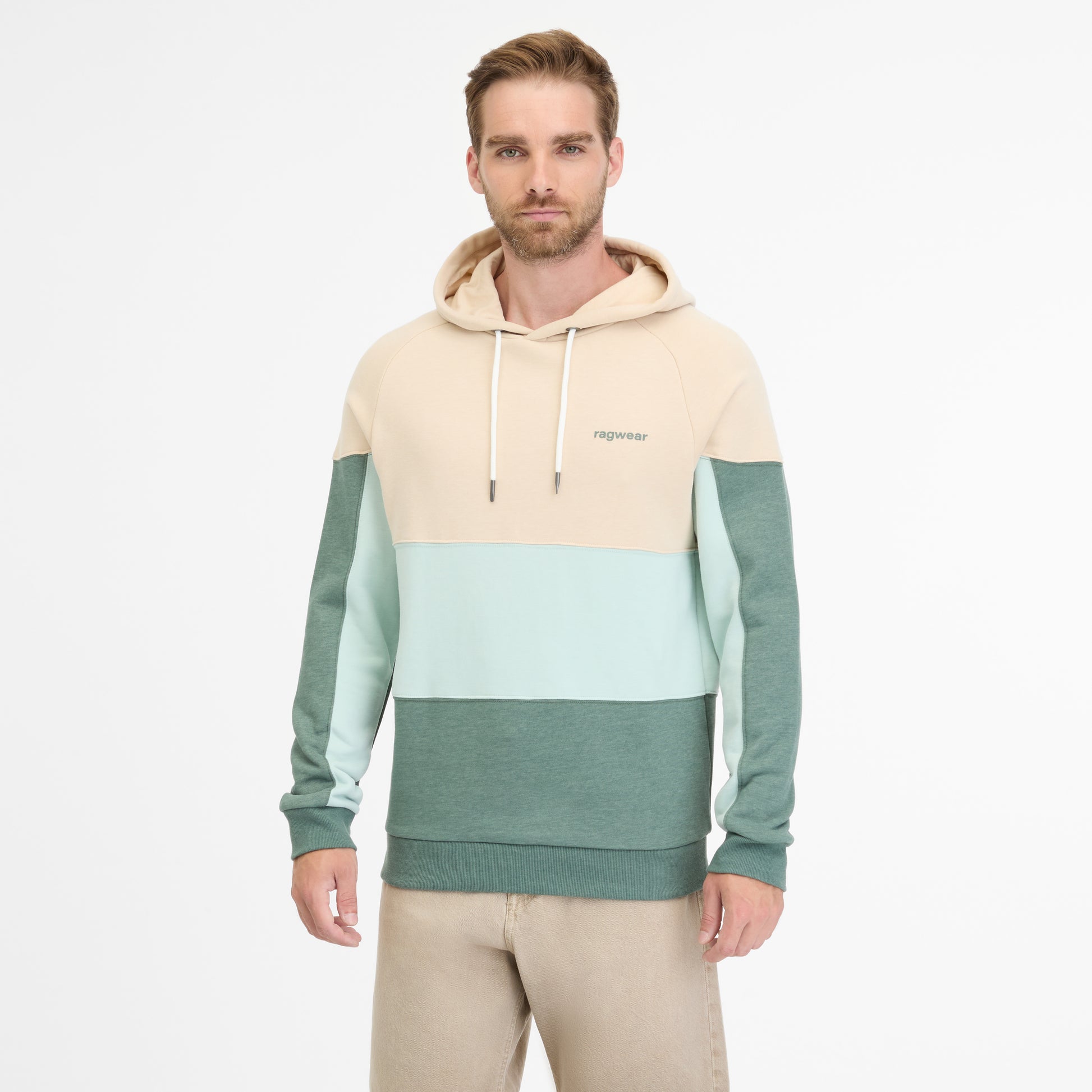 A person models the men's RAGWEAR BRESS HOODIE in beige, mint green, and dark teal with drawstrings and "ragwear" branding against a white background, paired with light beige pants.