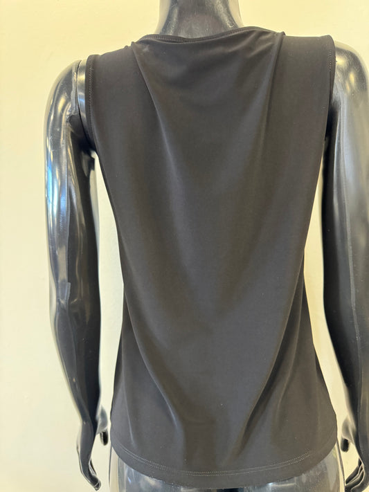Against a light background, a black mannequin displays the Tank Top 8326 by Bali Corp. This sleek, round-neck top is viewed from the back and embodies minimalist elegance. Made in Canada.