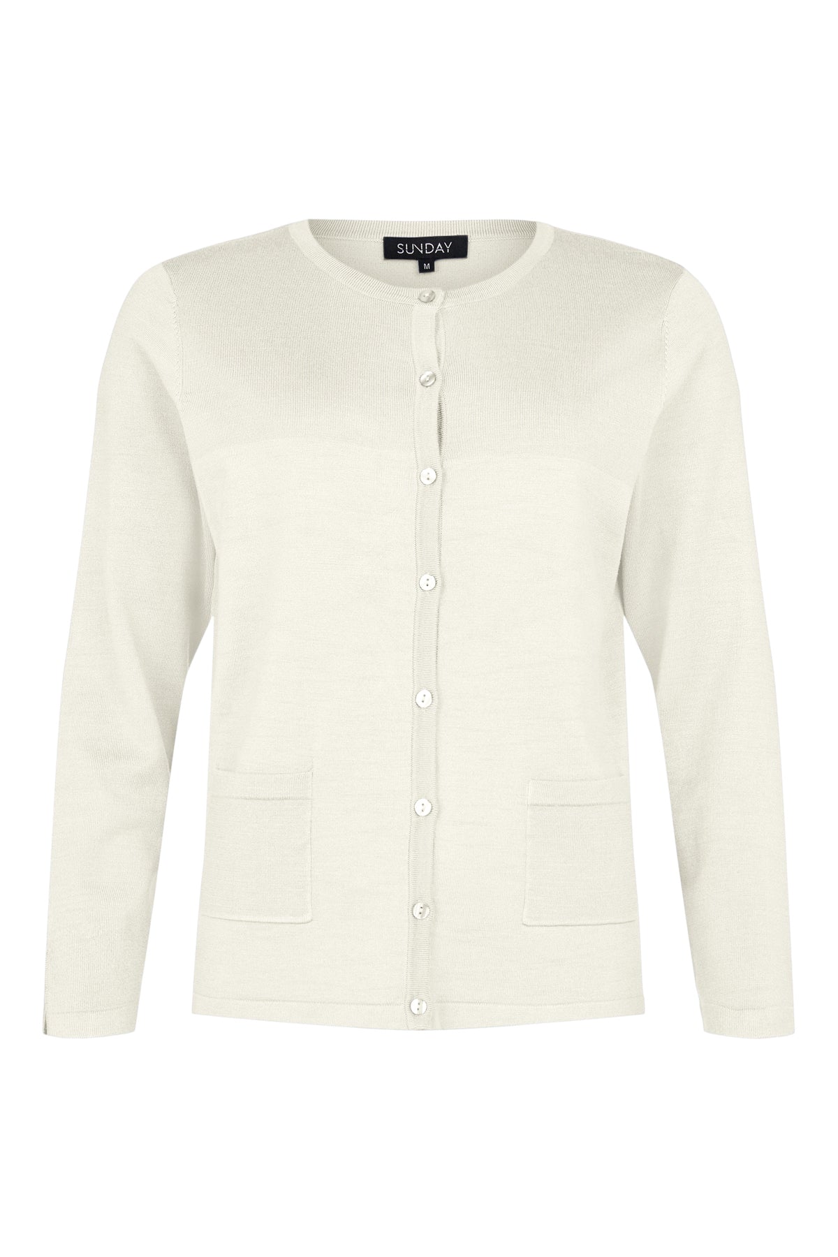 The Cardigan 6455 SUNDAY is a light green, long-sleeved piece featuring a crew neck, white buttons down the front, and two pockets. The "SUNDAY" label at the collar stands out against its plain white background for an elegant touch.