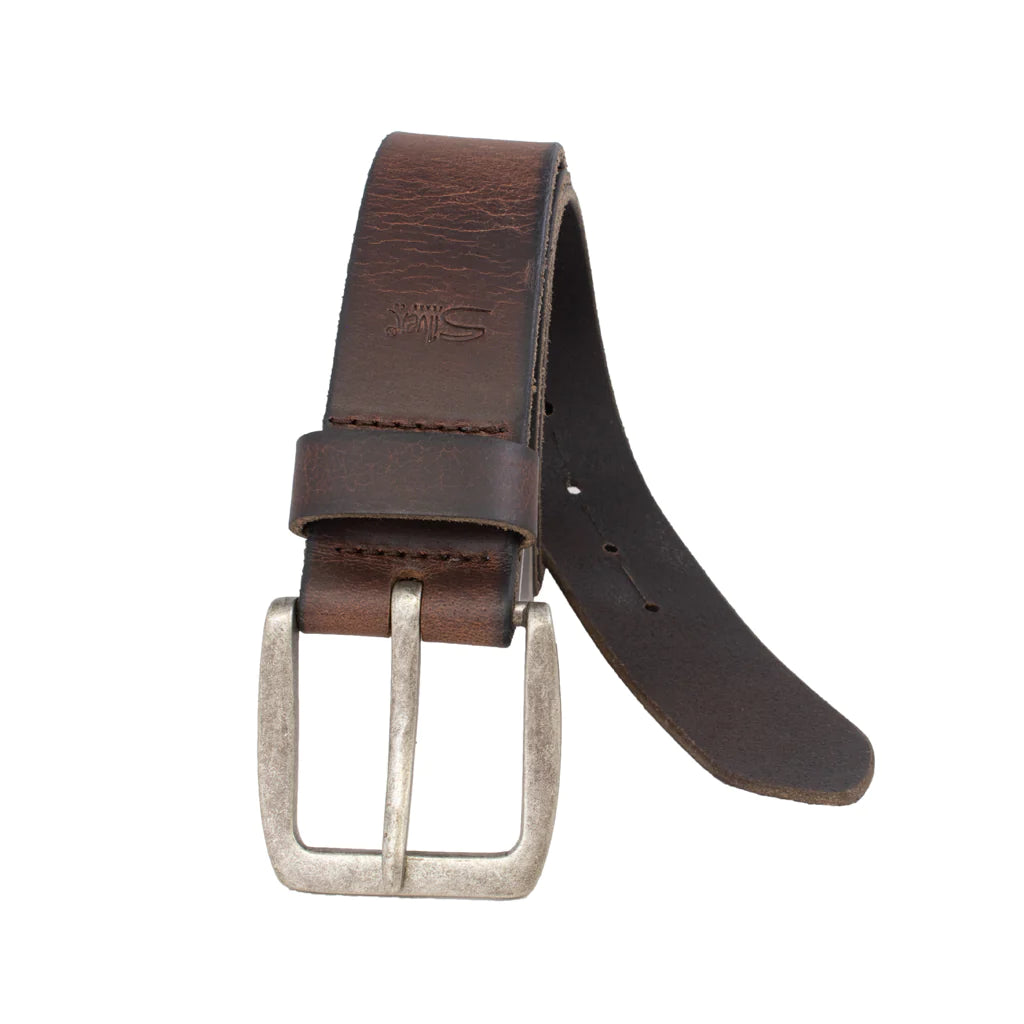 The Silver Jeans Co. 40MM Heavyweight Pull-up Genuine Leather Belt features a coiled, dark brown design with visible stitching along the edges and an aged antique nickel buckle. The leather boasts a textured, slightly distressed appearance, complemented by linear burnished detailing.