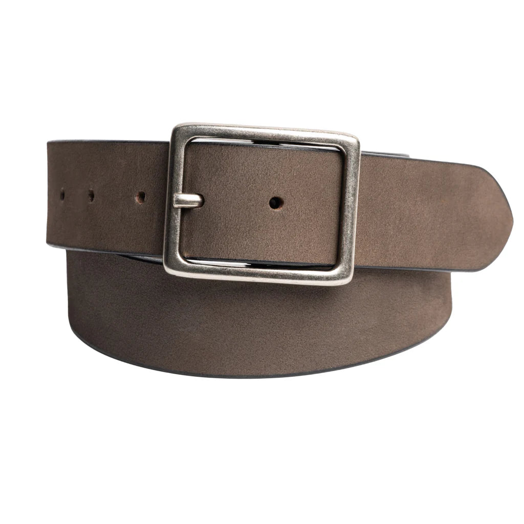 A close-up image of a brown Silver Jeans Co. 40MM Genuine Nubuck Leather Belt with a rectangular antique nickel buckle. The belt is rolled up, its tongue fed through the buckle, with a few open holes visible. The strap has a smooth finish and appears to be made of high-quality leather from Silver Jeans Co.
