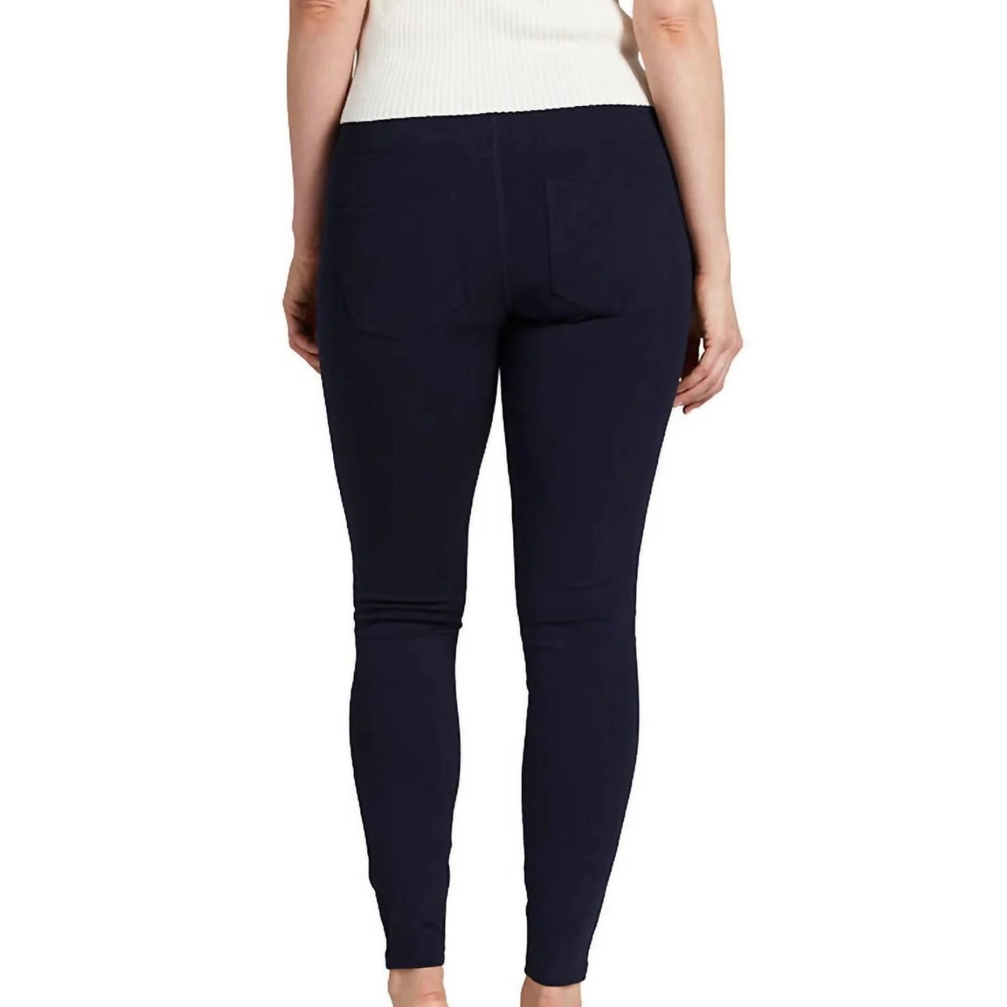 A person is wearing Ricki Mid Rise Leggings in navy by JAG with a white top. The photograph is cropped at the neck and ankles, focusing on the clothing. The background is plain white.