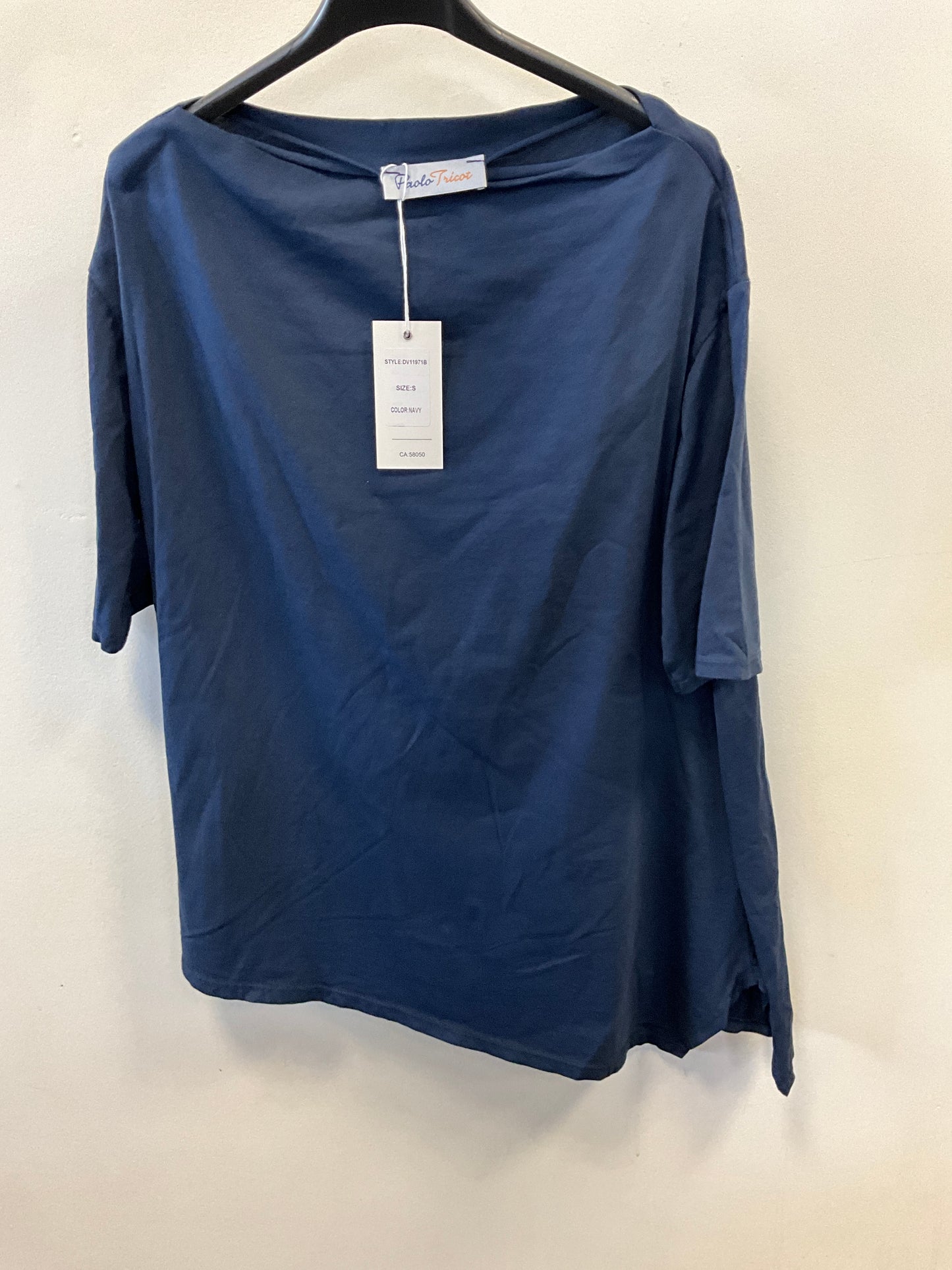 The Paolo Tricot Top DV11971B Navy is a loose-fitting, short-sleeved cotton shirt, shown on a black hanger against a white wall with a white tag on the collar—ideal for stylish summer wear.