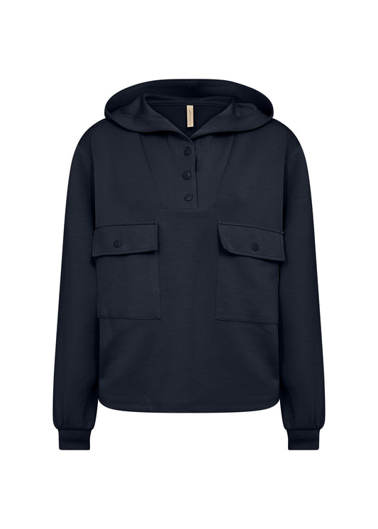 The 3 Snap Pull Over Hoodie Banu 219 by SoyaConcept in navy blue features a stylish button-up collar, two spacious buttoned flap pockets on the front, a cozy hood, and long sleeves with ribbed cuffs for comfort and practicality.
