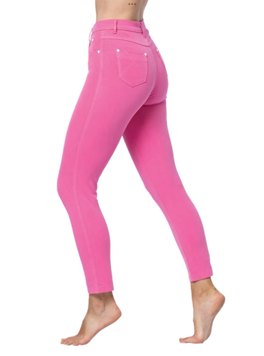 A person wears high-waisted, bright pink Jeans 2400-194 MARBLE by MARBLE, offering style and comfort. The skinny jeans feature back pockets and white stitching. The person stands barefoot on one leg with the other slightly raised against a plain white background.