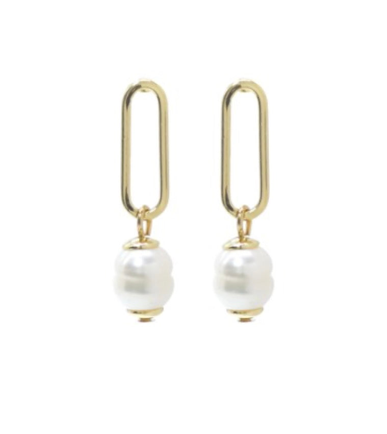 Dana 92 Gold Earrings by Elise Accessories: gold paperclip earrings with a single round white pearl dangling at the bottom, shown against a white background.