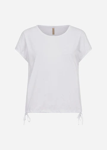 A person with long, blonde hair is wearing a white SC-DERBY 33 T-SHIRT from SoyaConcept, featuring a round neckline. They have paired it with yellow drawstring pants and are standing against a plain, light-colored background. Their expression is neutral as they look directly at the camera.