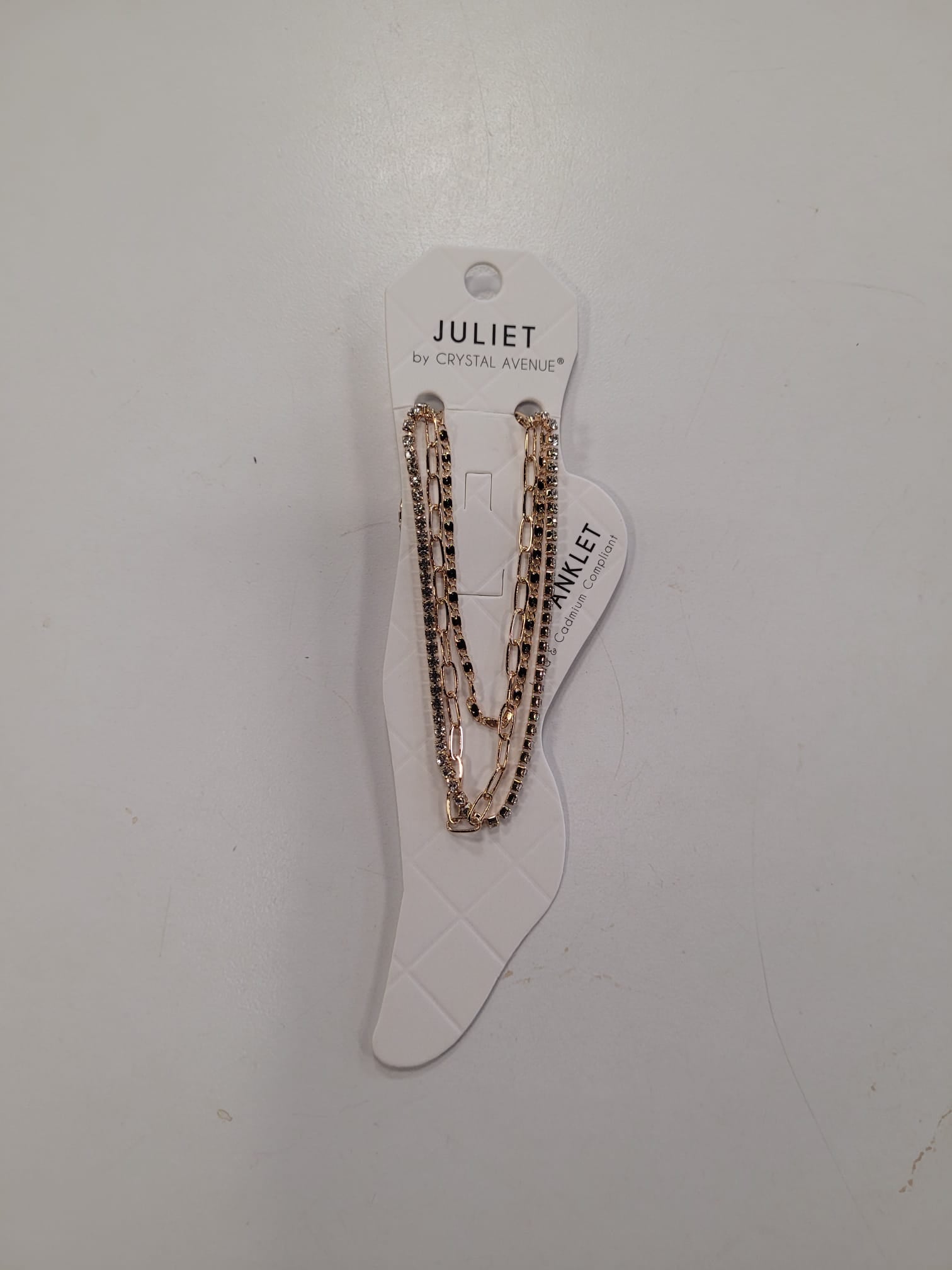 The Angela 5 Anklet by Elise accessories is showcased on a branded tag against a plain white background—an ideal accessory for special occasions.