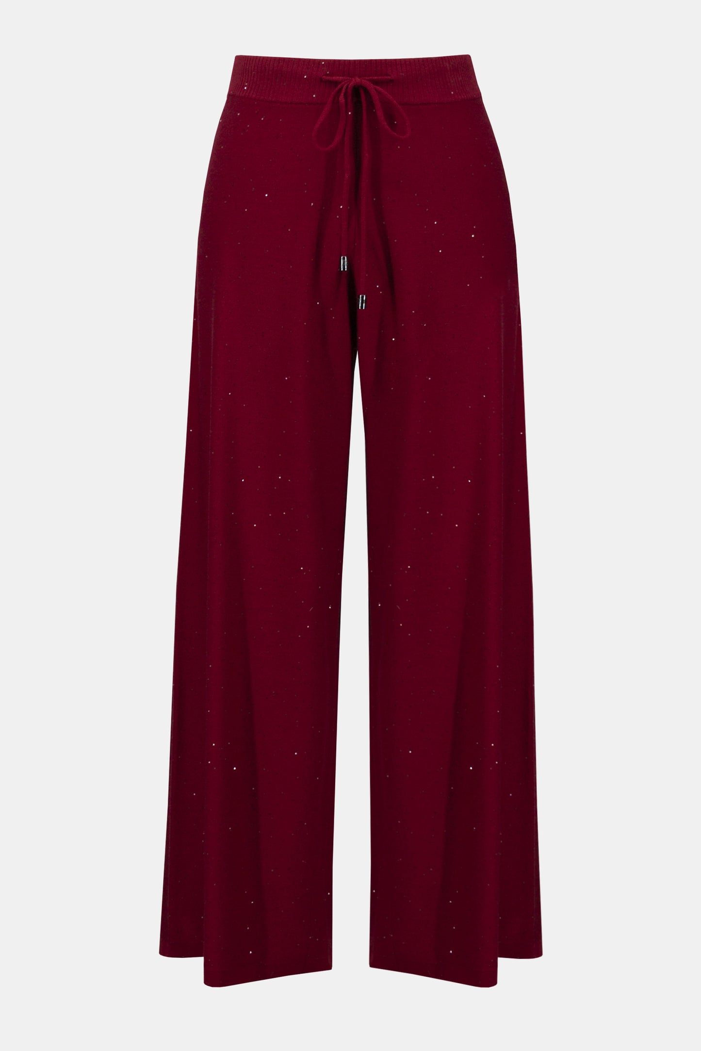 Joseph Ribkoff Sequined Sweater Knit Culotte Pants 244922F25 feature a wide-leg silhouette, elastic waistband with drawstring, and subtle sparkly speckles throughout the maroon sequin sweater knit fabric.