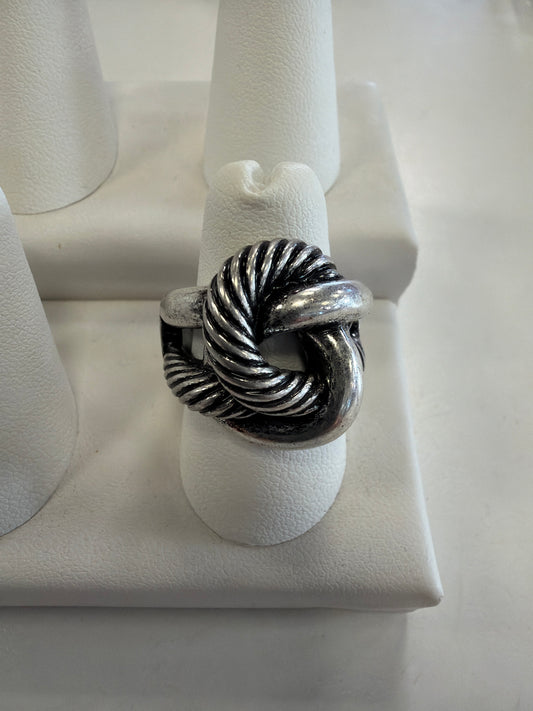 Jenna 98 Ring featuring an oxidized rope knot design, displayed on a white stand.