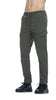 A cropped image shows a person wearing Zevl Dark Oliven Trousers by RAGWEAR, featuring a drawstring waist and side pockets, paired with black sneakers. The person's torso is not visible, and the vegan trousers have a casual, relaxed fit perfect for any casual occasion.