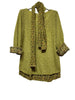 The LINEN & COTTON HOUSE “Tunic with scarf 1111 VINTAGE: OLIVE” features a light olive-green long-sleeve tunic adorned with vintage-inspired floral accents on the cuffs and hem, complemented by a matching floral scarf. Both pieces are tastefully showcased on a hanger against a white background.