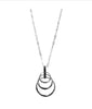 The Ava 3 Silver Necklace by Elise accessories features a delicate chain with four interlocking rings in descending sizes, offering a minimalist, modern twist on classic costume jewellery, shown against a plain white background.
