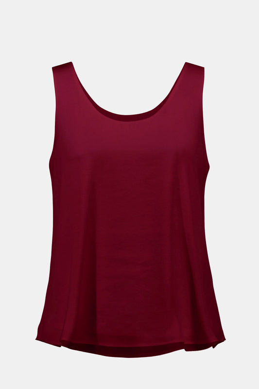 The Joseph Ribkoff Recycled Hammered Satin Sleeveless Top 253292 features a loose fit, scoop neckline, and solid burgundy color, shown on a plain white background.