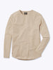 A beige AO Long Sleeve Curve-Hem tee is laid flat on a white background. This signature-fit t-shirt by CUTS features a simple design with a rounded neckline and is crafted from PYCA Pro fabric. A small tag near the collar displays the brand name, "CUTS".
