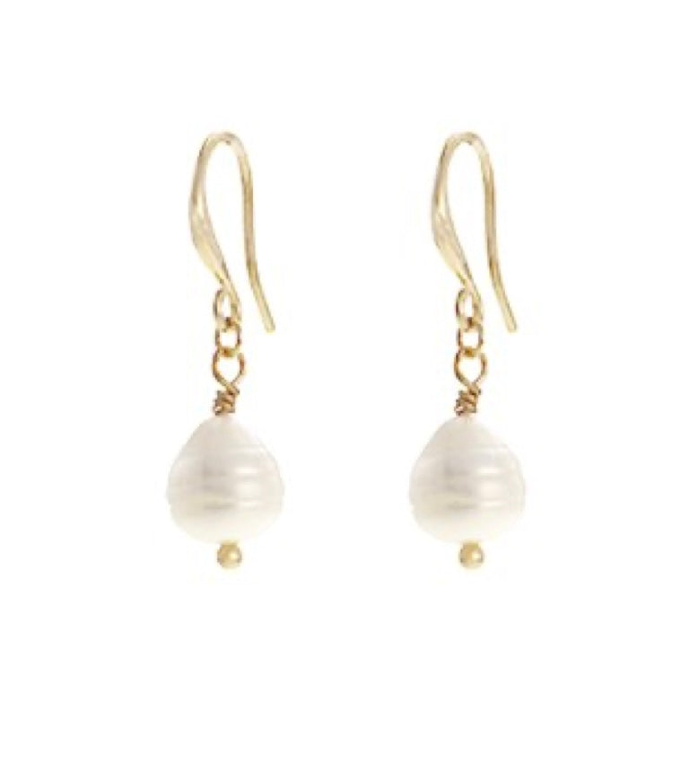 The Zoey 68 Gold earrings by Elise Accessories feature single white, round freshwater pearls delicately dangling from gold hooks against a plain white background.
