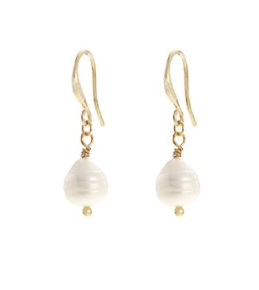 The Zoey 68 Gold earrings by Elise Accessories feature single white, round freshwater pearls delicately dangling from gold hooks against a plain white background.