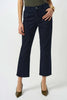 A person in dark blue Joseph Ribkoff Margot Classic Straight Leg Stretch Jeans 252926F25, a green top, gold bracelet, and olive green pointed-toe heels stands against a plain white background.