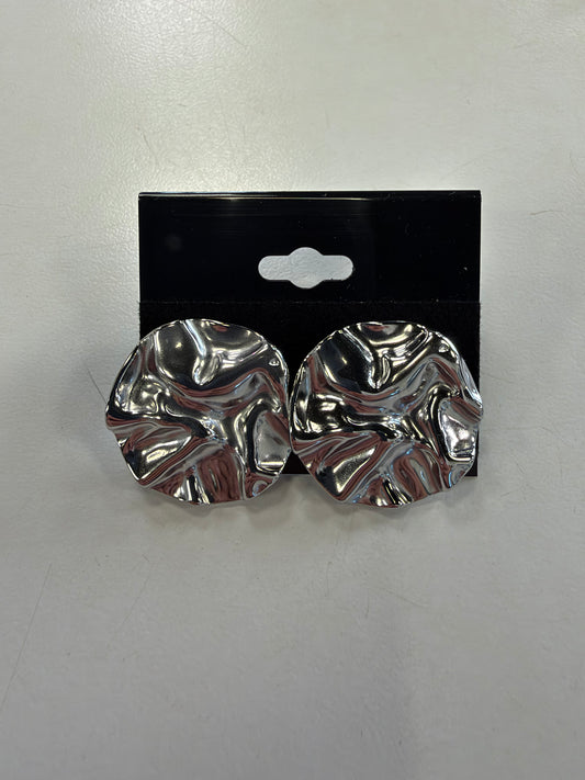Pair of silver-toned hammered round Dior 11 Earrings with a wavy, rippled surface, displayed on a black earring card.
