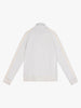 A white sand long-sleeve Haku Track Jacket by Once We Were Warriors is spread out flat against a plain background. The jacket features a collar, wide cuffs, and vertical stripes running down the length of each sleeve. The back of the jacket is visible with no discernible patterns or logos, except for some small text at the top center.