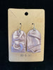 A pair of metallic pink, arched earrings with a draped fabric-like texture, crafted from polymer clay, is displayed on a beige card labeled "RO&JO" at the bottom and featuring a hole for hanging at the top. The product is named Ro&Jo Earrings 432. The background is black.