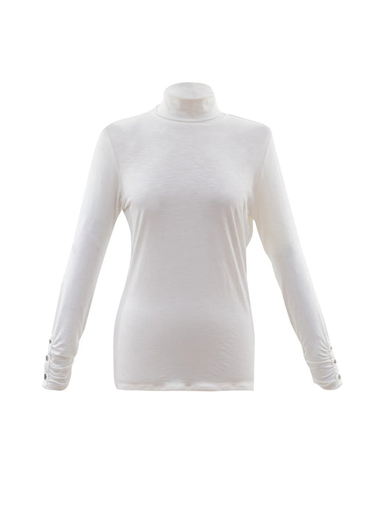 The Turtleneck Top w/Ruche Cuff & Button Detail 6400 MARBLE by MARBLE is showcased on a plain white background. This white long sleeve turtleneck shirt, crafted from lightweight viscose, features a fitted design with subtle button details and ruched cuffs near the wrists.