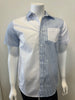 A mannequin showcases the Men’s Cotton Shirt - STRIPE WHITE/BLUE by Silver Jeans Co., which features a button-up style with alternating vertical white and blue stripes on the right side and pocket. The left side and sleeves are solid white, prominently displayed against a plain backdrop that accentuates the garment's unique design.