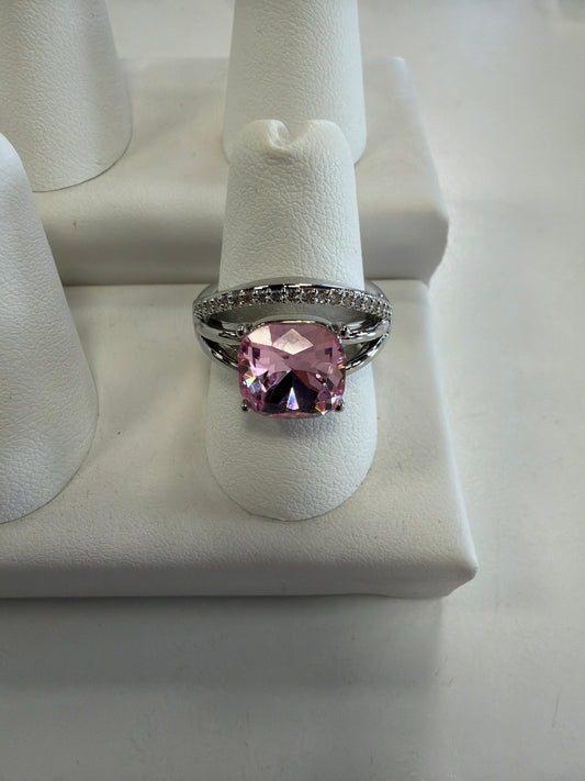 Jenna 96 Ring in silver, featuring a large, square-cut pink gemstone on a stretch band accented with small white stones.
