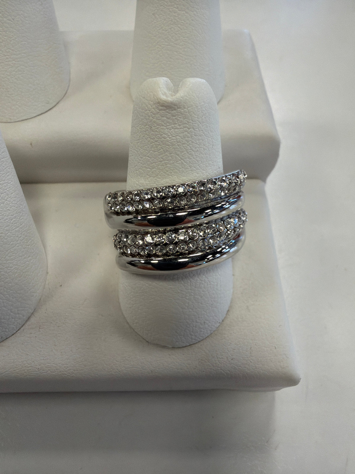 Jenna 76 Ring, a wide silver band featuring two rows of inlaid crystals separated by a polished metal center.