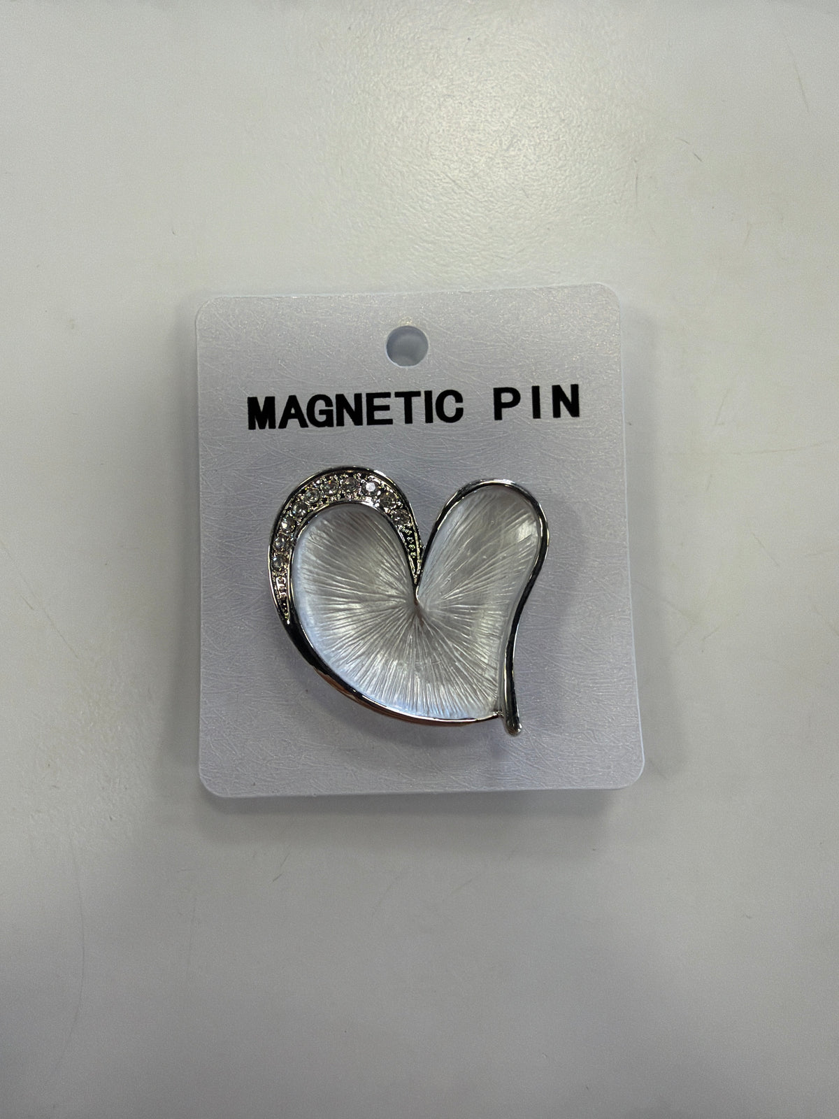 Elise Accessories Denise 12 Brooch, a silver heart pin with a pearlescent white center and crystal-accented edge on a white display card.
