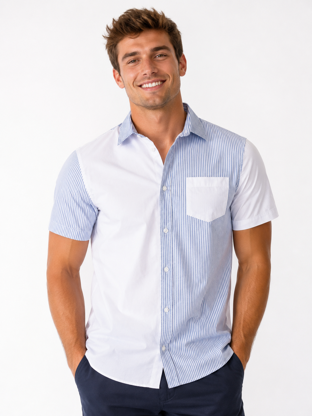 A smiling man stands with his hands in his pockets, wearing the Silver Jeans Co. Men’s Cotton Shirt - STRIPE WHITE/BLUE and navy pants, set against a plain white background.