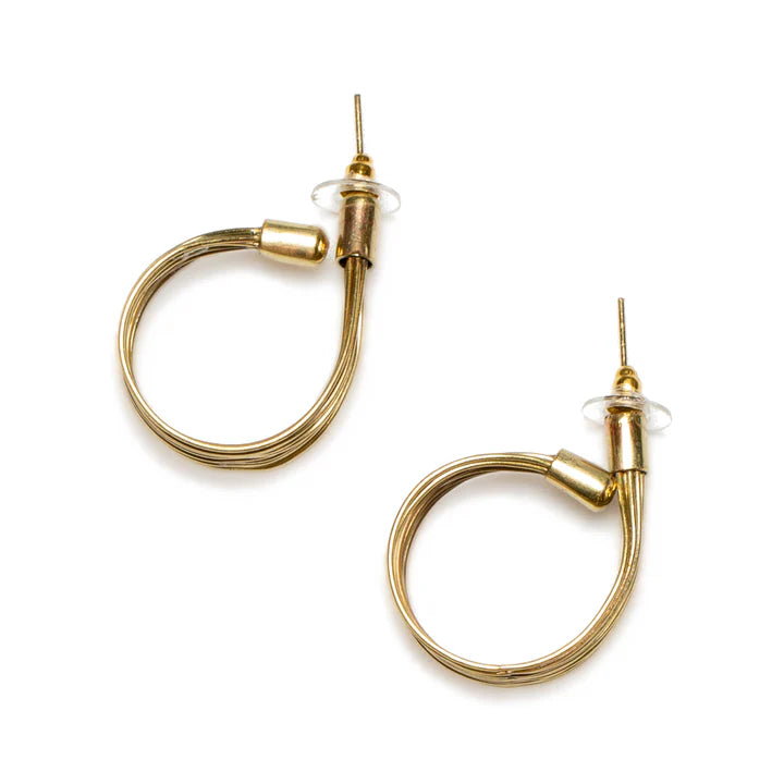 The Wire Loop Metal Earrings in Gold Colour by Suzie Blue showcase a distinctive twisted wire loop metal design and are secured with clear backings. Crafted from nickel-free plated brass, these earrings are displayed on a white background with their posts pointing upwards.