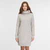 A person with long, wavy hair is wearing the RAGWEAR Sweater Dress Ditia Bone 2421-20007-7001 in a light gray shade. This long-sleeved, knee-length turtleneck dress features pockets on both sides. Set against a plain white background, this piece of vegan streetwear from RAGWEAR stands out clearly.