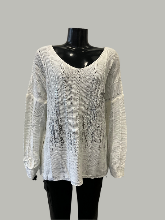 A timeless Eternelle V-neck Sweater with Shiny Front Ivory is displayed on a black mannequin against a plain gray background. This luxurious loose-knit, long-sleeve piece from ETERNELLE features a subtle vertical black streak pattern on the front and slightly oversized sleeves, making it an elegant wardrobe staple.