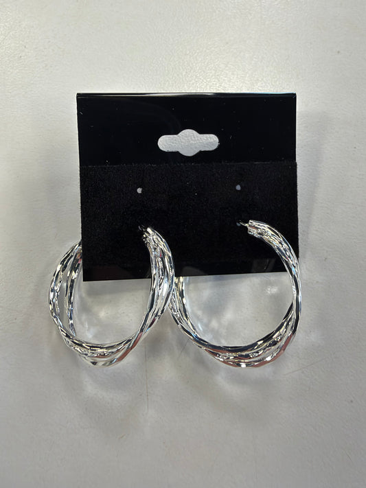 Sky 6 Earrings feature three-strand twisted silver hoops with a multi-layered design on a black display card.