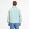 Facing away with short hair, a person wears a light blue CORDYREO DENIM 2512-60004-2042 by RAGWEAR with jeans against a plain white background, enhancing the casual look.