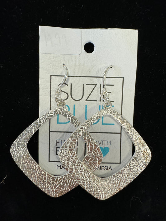 A pair of elegant dangle earrings with a textured, geometric rounded square design, labeled as "Rounded Square Earrings - Suzie Blue," are displayed on a white card. The card indicates the product is "Handmade with Love" in Indonesia and priced at $9.49.