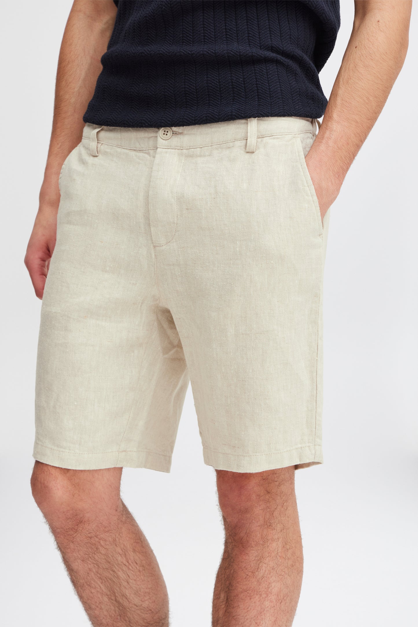 Model showcases the Linen Shorts 20505166 by Casual Fridays in light beige with a black ribbed shirt, hand in pocket. Only the lower torso and upper legs are visible, highlighting style and comfort ideal for Casual Fridays.