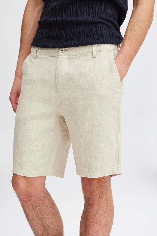 Model showcases the Linen Shorts 20505166 by Casual Fridays in light beige with a black ribbed shirt, hand in pocket. Only the lower torso and upper legs are visible, highlighting style and comfort ideal for Casual Fridays.