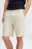 Model showcases the Linen Shorts 20505166 by Casual Fridays in light beige with a black ribbed shirt, hand in pocket. Only the lower torso and upper legs are visible, highlighting style and comfort ideal for Casual Fridays.