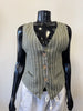 A black mannequin displays a Bella Amore Linen Vest 08003 in green pinstripe, made in Italy, featuring a V-neck and three wooden buttons. It has two pockets and is perfectly paired with white drawstring pants, all set against a plain white background.