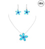 The Nicole 43 TUQ Necklace & Earring Set by Elise Accessories features blue flower-shaped earrings and a turquoise flower necklace on a silver chain. The "elise" logo is displayed in a black circle in the top right corner.
