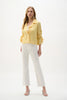 A woman with long, wavy blonde hair models the Joseph Ribkoff Woven Seersucker Boxy Blazer With Shirred Sleeves (262143) against a plain white background, paired with white cropped pants and white heels.