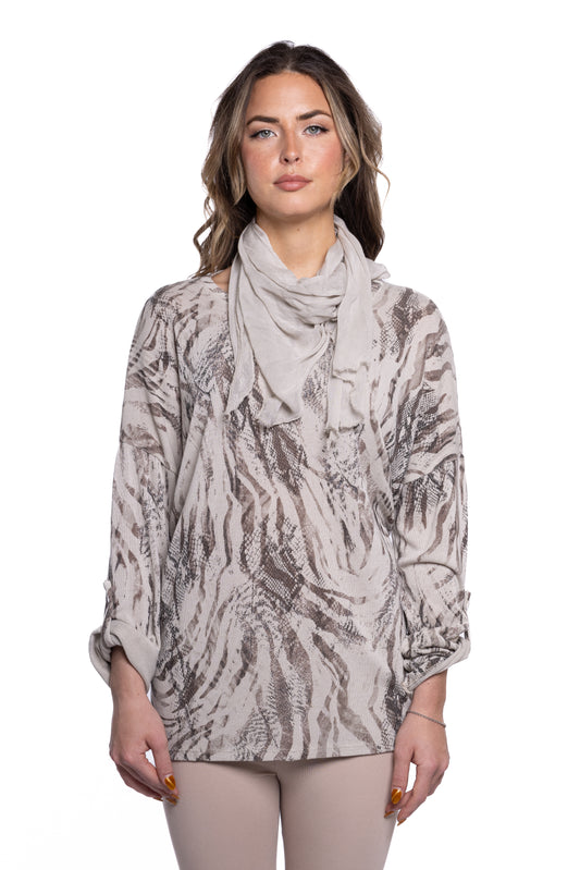 A person with long wavy hair, wearing an ETERNELLE Tunic Top with Snake Skin Scarf, stands against a white background. They have a neutral expression and their arms rest by their sides.