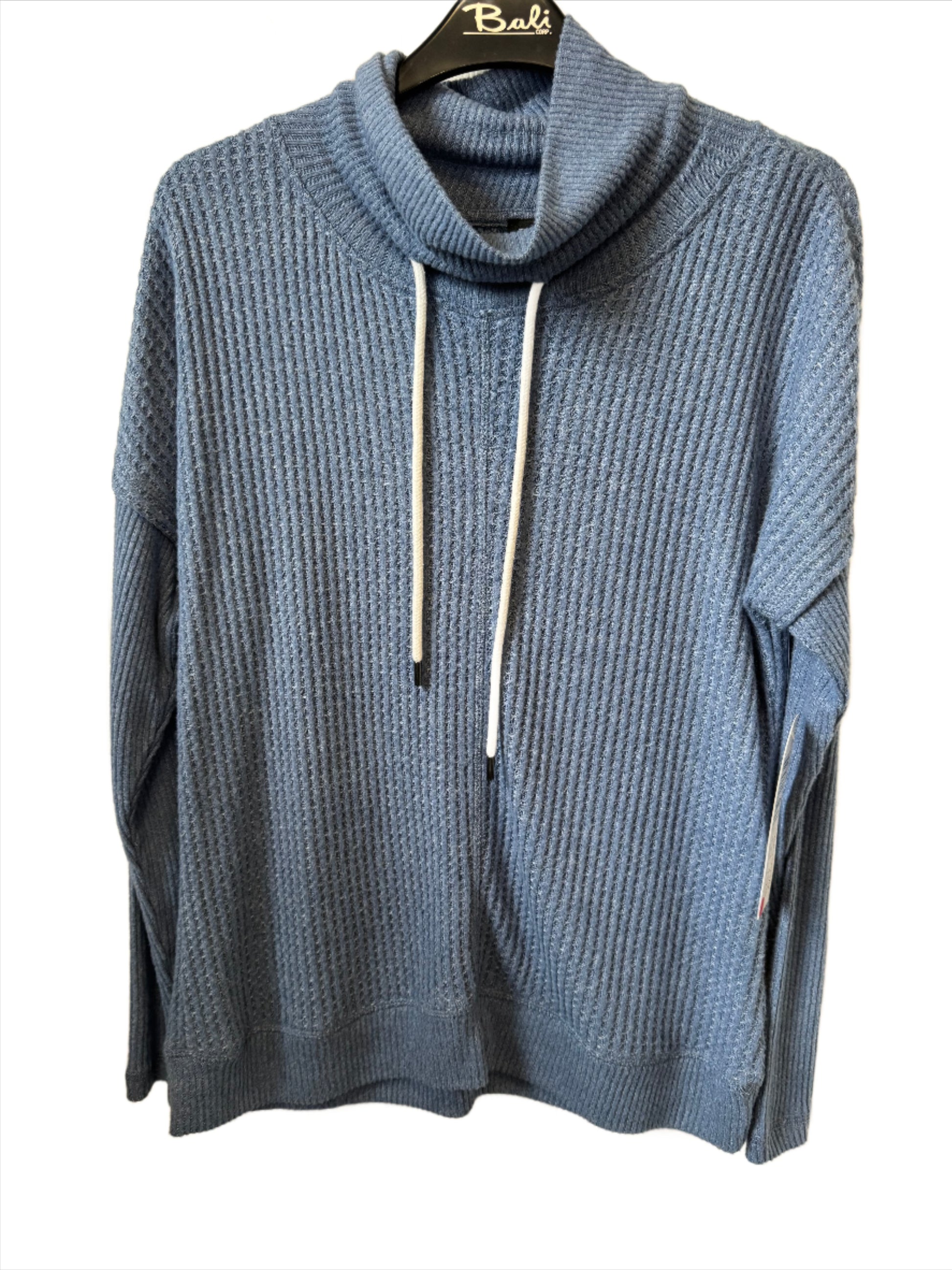 A cozy, arctic blue cowl neck sweater with long sleeves, ribbed texture, and white drawstrings from the brand Tribal. The Cawl Neck Sweater - TRIBAL is displayed on a black hanger labeled "Bali.