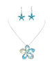 The Nicole 42 TUQ Necklace & Earring Set by Elise Accessories features a silver necklace with a blue and yellow floral pendant and matching earrings, each adorned with central gems.
