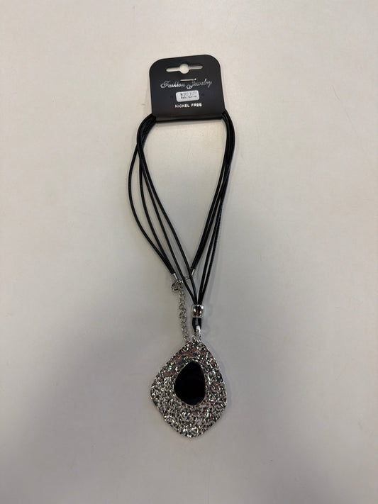 The Elise accessories Sofia 33 necklace features a multi-strand black cord with a large, burnished teardrop pendant and a smooth black center inlay.