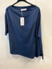 The Paolo Tricot Top DV11971B Navy is a loose-fitting, short-sleeved cotton shirt, shown on a black hanger against a white wall with a white tag on the collar—ideal for stylish summer wear.