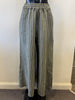 Bella Amore showcases Linen Pants 1045, gray wide-leg pants with green and white stripes, on a mannequin. These pants have an elastic waistband and a loose fit, set against a light-colored wall and carpeted floor.