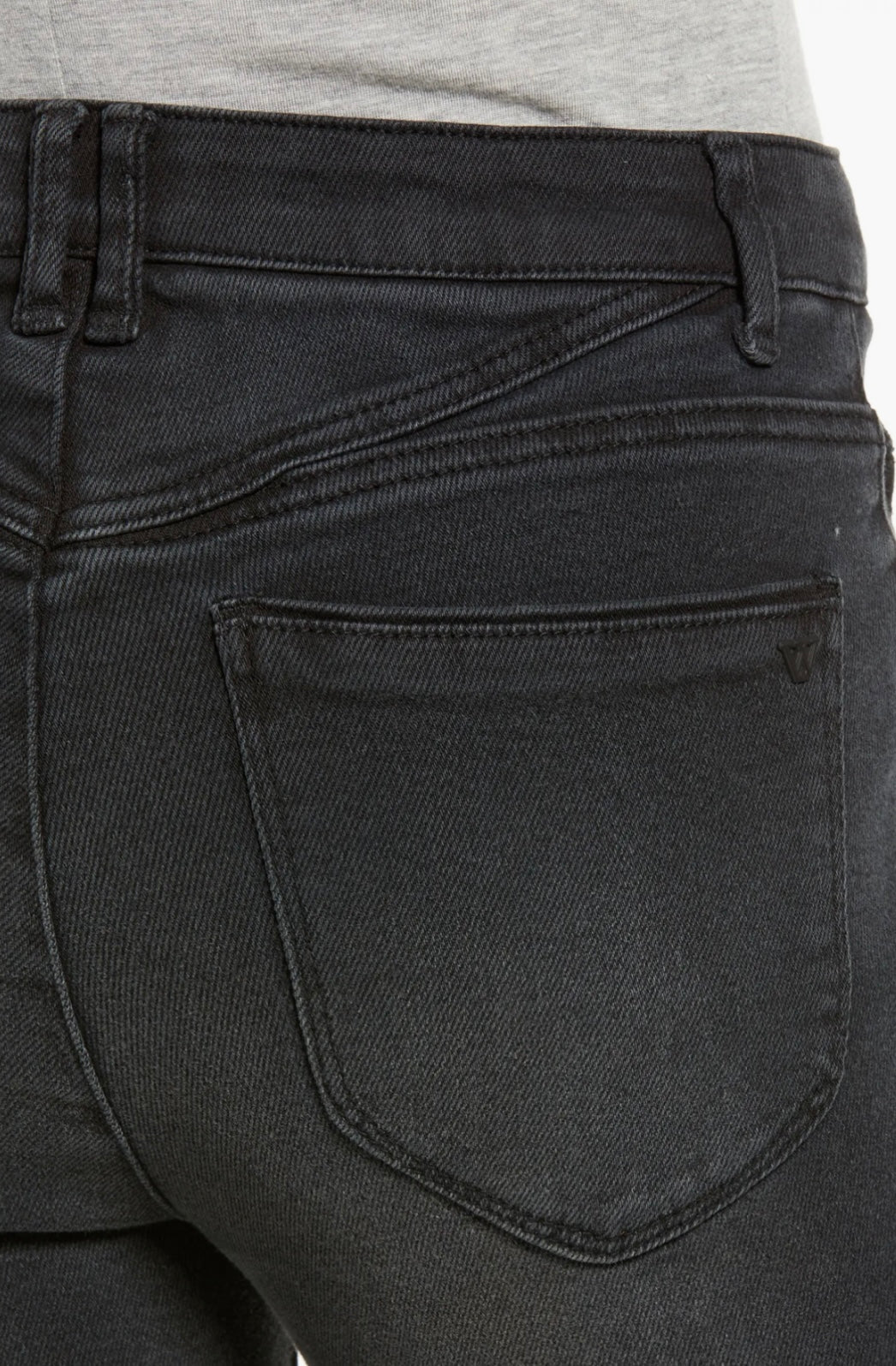 A person wearing a light gray long-sleeve shirt, black high-waisted Bennet Skyrise Jeans L2269E4D4 from Wit & Wisdom at Nordstrom, and slip-on shoes with a snakeskin pattern. The image is cropped just above the person's shoulders.